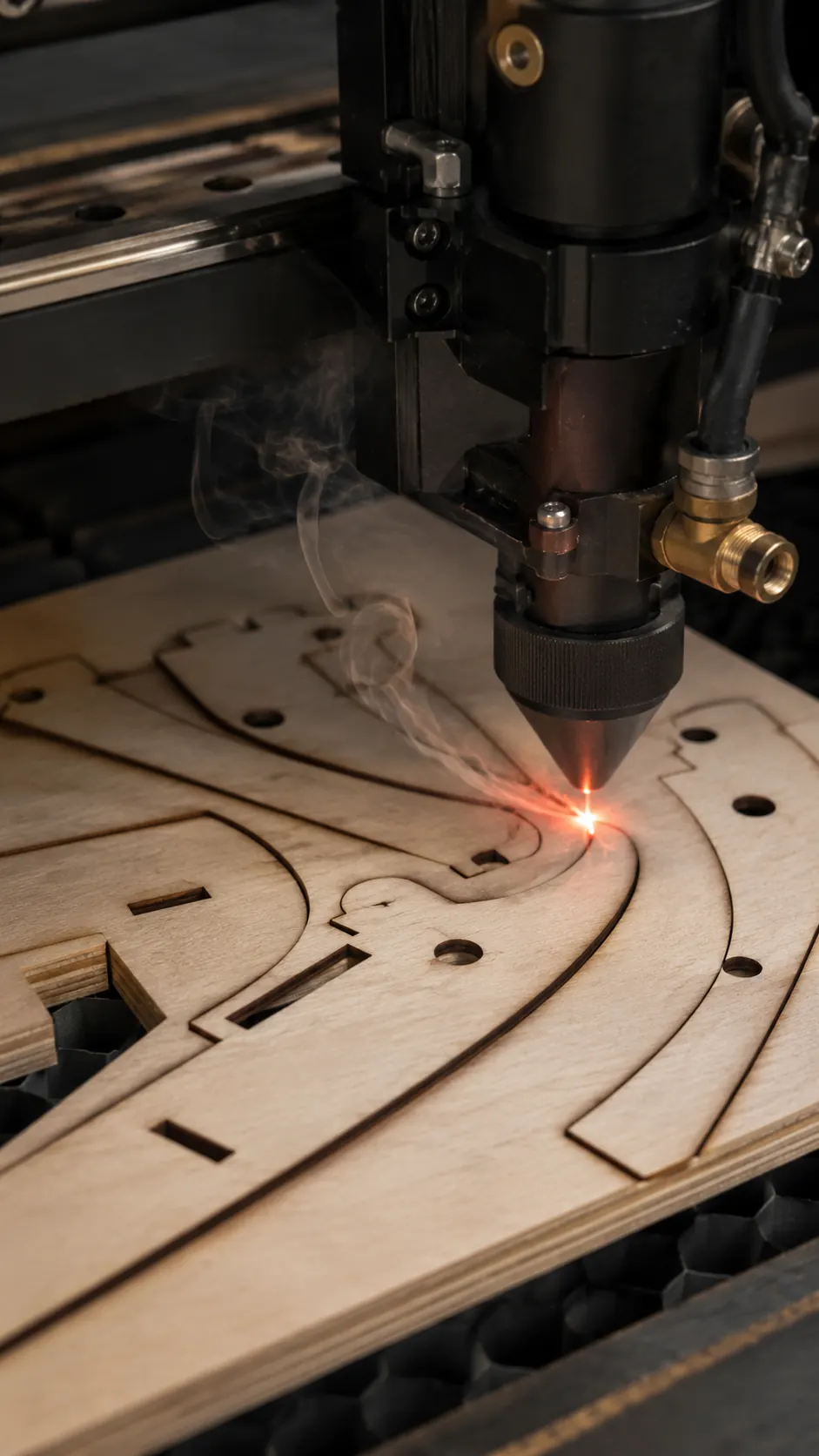 Laser cutter head cutting plywood UAV ribs